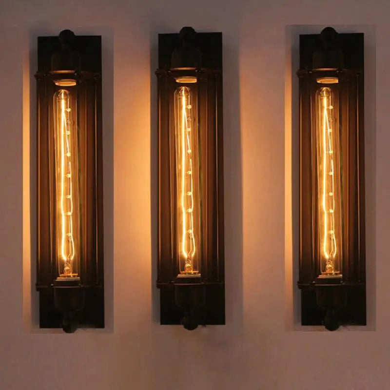 IronGlow Industrial Wall Sconce - Black metal cage design with E27 bulb holder, perfect for vintage industrial lighting. VelunaLumin.