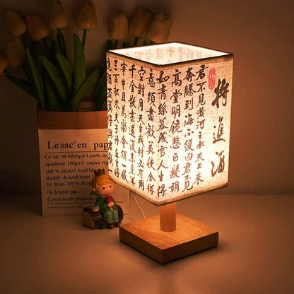 SereneScape Artisan Table Lamp with 'Celestial Cranes' oriental art linen shade, dimmable warm light, and solid wood base. VelunaLumin