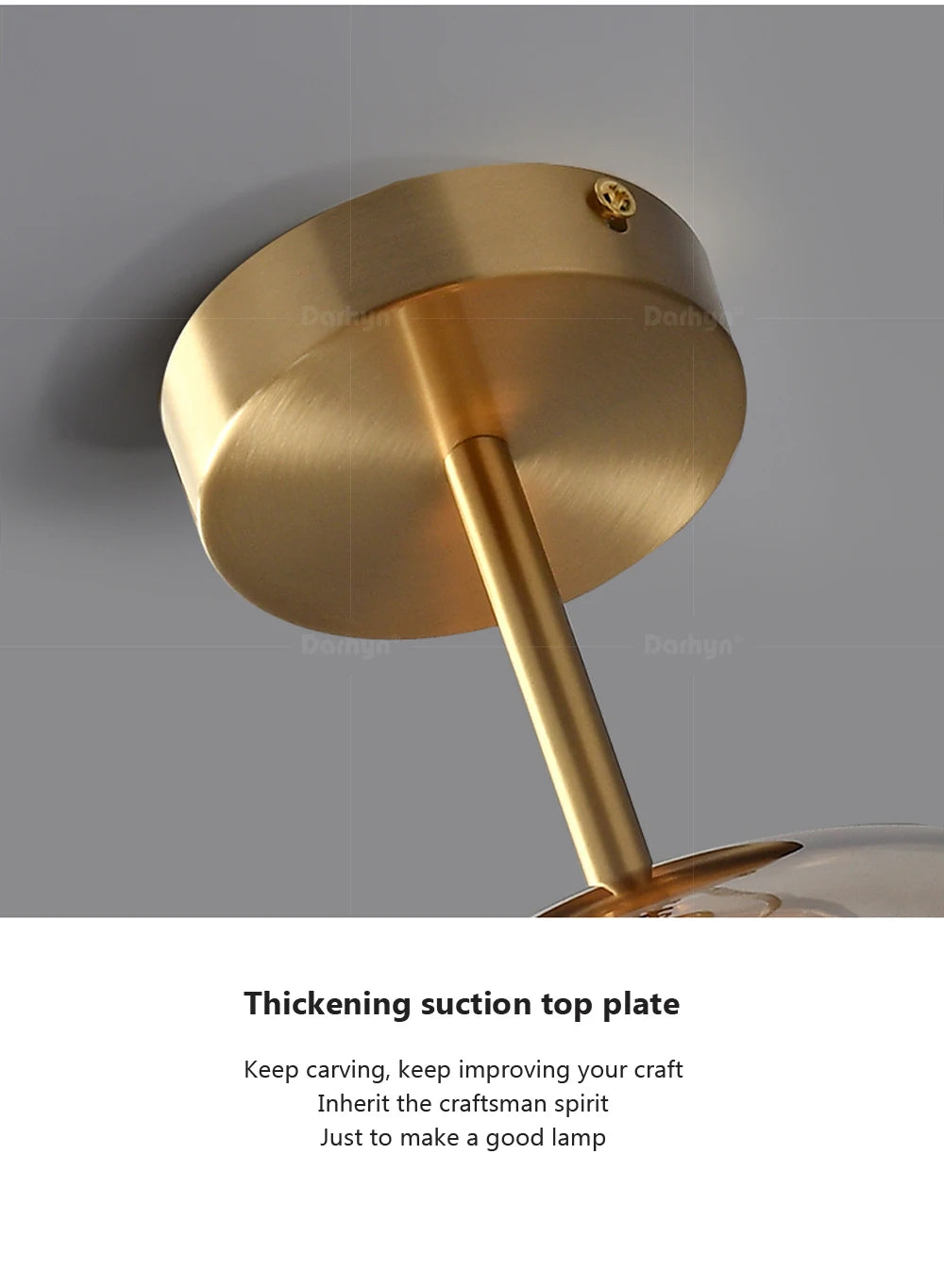 Close-up of the AuraSphere Ceiling Light, showcasing the quality of the hand-blown glass and the premium polished gold metal base. VelunaLumin.