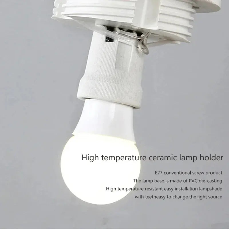 Close-up of the AuraOrb Ceiling Light showing the detail of the frosted glass globe and the premium metal base in a brushed gold finish. VelunaLumin.