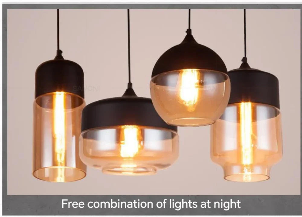 Close-up of LuminaGrace Rich Amber & Clear Glass Slim Cylinder Pendant Light, highlighting the rich amber metal base and pristine clear glass shade, showcasing the bulb within, VelunaLumin exclusive design.