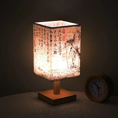 SereneScape Artisan Table Lamp with 'Sakura Bloom' oriental art linen shade, dimmable warm light, and solid wood base. VelunaLumin.