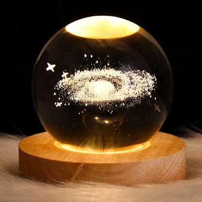 Cosmos 3D galaxy crystal sphere night light on wood base.