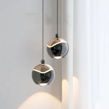 AuraSpire Architectural Pendant Light in a sleek Matte Black finish, featuring a minimalist aluminum body and optical spotlight lens. VelunaLumin.