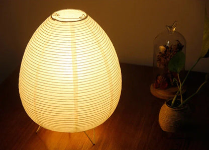 Close-up of the Akari Rice Paper Lamp, showcasing the delicate texture of the handcrafted rice paper shade and its unique, sculptural form. VelunaLumin.