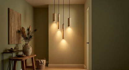 Cluster of TerraGlow Natural Stone Pendant Lights in a modern entryway, creating a warm, inviting welcome with textured light patterns from natural cave stone. VelunaLumin.