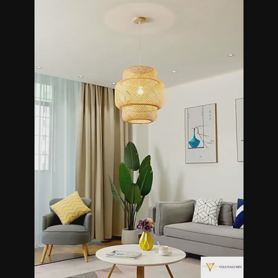 Three ZenWeave 'Tiered Serenity' bamboo pendants hanging over a modern sushi bar, casting a warm, inviting light and creating an authentic, serene oriental atmosphere. VelunaLumin.