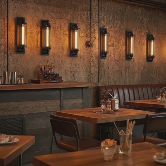 IronGlow Industrial Wall Sconce - Black metal cage design with E27 bulb holder, perfect for vintage industrial lighting. VelunaLumin.