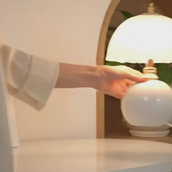 NouveauGlow Murano-Style Mushroom Lamp in Classic White, Pink and Creme, with a hand-blown striped glass shade and ceramic base. VelunaLumin.