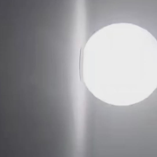 Close-up of the AuraOrb Ceiling Light showing the detail of the frosted glass globe and the premium metal base in a brushed gold finish. VelunaLumin.