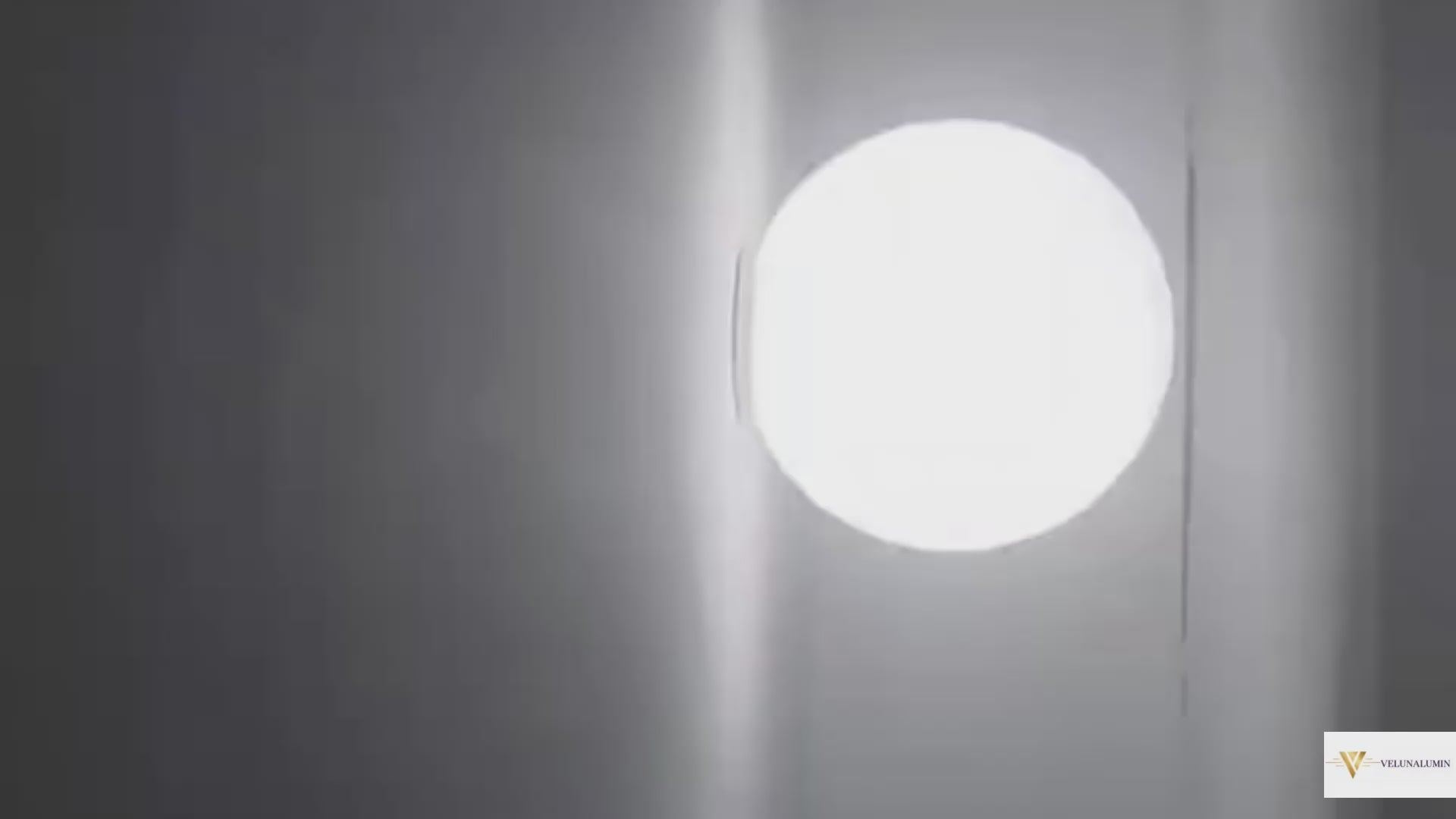 Close-up of the AuraOrb Ceiling Light showing the detail of the frosted glass globe and the premium metal base in a brushed gold finish. VelunaLumin.