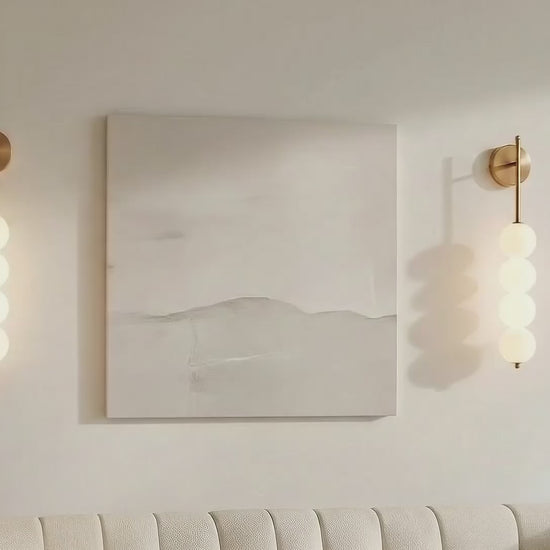 Close-up of the AuraBeam Wall Sconce, showing the detailed perforated metal and the quality of the plated finish. VelunaLumin.