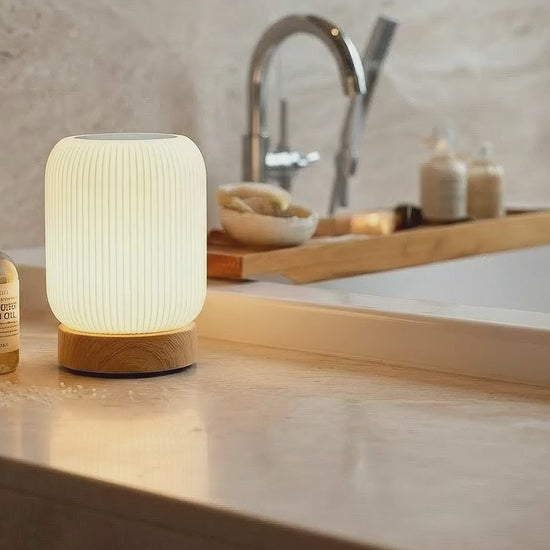 AuraShroom Portable Touch Lamp, a dimmable mushroom-shaped LED night light, in a modern white finish. VelunaLumin.