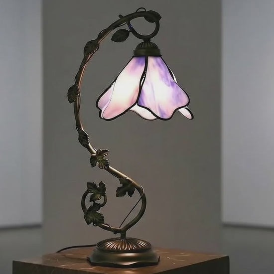 LuminaGlow Tiffany Desk Lamp - Handcrafted stained glass shade with dominant blue hues, antique metal base, E27 compatible. VelunaLumin.